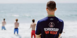 A State Lifeguard watches over candidates testing to become lifeguards