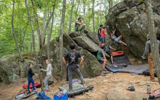 A group of people climbing at Lincoln Woods State Park