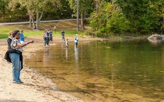 Shoreline fishing for trout at Lincoln Woods State Park
