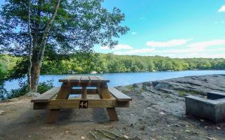Picnic table overlooking Olney Pond at Lincoln Woods State Park