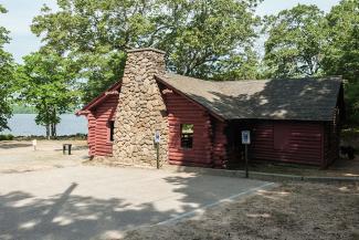 Log cabin pavilion at Burlingame State Park in Charlestown