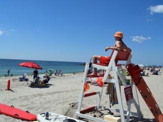 A lifeguard overlooks the water at Charlestown Breachway