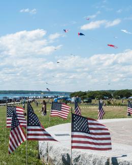 Brenton Point State Park with American flags and kites on the Fourth of July